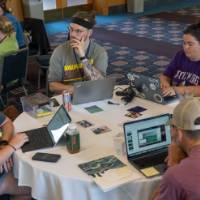roundtable overhead of persons working collaboratively indoors